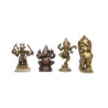 FOUR DEVOTIONAL COPPER ALLOY STATUETTES OF THE HINDU GOD GANESHA India, 18th and 19th centuries