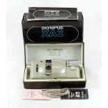 A Boxed "Urban White" Coloured Olympus XA2 Compact Camera.