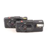A Pair of Olympus XA Compact Rangefinder Cameras.