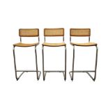 IN THE MANNER OF MARCEL BREUER (HUNGARIAN, 1902 - 1981) THREE TEAK BAR STOOLS