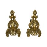 A PAIR OF GILT BRASS ROCOCO STYLE ANDIRONS