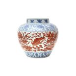 A CHINESE COPPER RED-ENAMELLED BLUE AND WHITE 'LOTUS POND' JAR