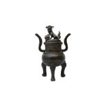 A CHINESE BRONZE TRIPOD INCENSE BURNER AND COVER