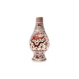 A LARGE CHINESE IRON RED-DECORATED 'DRAGON AND PHOENIX' VASE