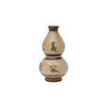 A CHINESE SLIP-DECORATED DOUBLE-GOURD VASE