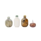 A GROUP OF FOUR CHINESE GLASS AND HARDSTONE SNUFF BOTTLES