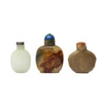 TWO CHINESE CELADON JADE AND ONE GLASS SNUFF BOTTLE