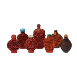 A GROUP OF FIVE LACQUER-STYLE BOTTLES AND TWO RESIN BOTTLES