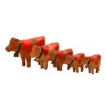 GROUP OF CARVED WOODEN CATTLE