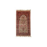 AN EXTREMELY FINE CHINESE SILK PRAYER RUG IN HEREKE STYLE