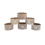 A SET OF SIX VICTORIAN STERLING SILVER NAPKIN RINGS, LONDON 1896 BY JOSIAH WILLIAMS AND CO