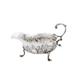 A GEORGE III STERLING SILVER CREAM BOAT, LONDON 1763 BY IS AND AN (UNIDENTIFIED)