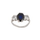 A sapphire and diamond three-stone ring