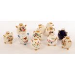 Eight Royal Worcester spherical cauldron vases,