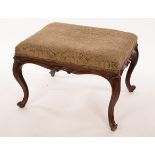 A mid 19th Century mahogany stool with C-scroll surround, on cabriole legs with scroll toes,