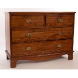 A mahogany chest of two long and two short drawers inlaid boxwood stringing on bracket feet,