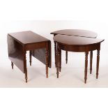 A mahogany dining table with two D ends and two flap centre, raised on twelve turned legs,