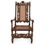 A late 17th Century Flemish carved walnut and cane high-backed open armchair, restorations,