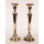 A pair of silver candlesticks, Birmingham 1928, of hexagonal column form, weighted, 29.