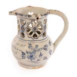 An English Delftware puzzle jug inscribed with a poem,