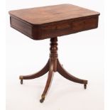 A Regency rosewood lamp table, with rounded top and two drawers on splayed quadripartite base,