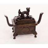 A Japanese bronze incense burner with a copper liner, the pierced cover with Fo dog finial,