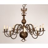 An early 20th Century Bavarian chandelier with double headed eagle surmount above ten scrolling