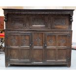 A very large Charles II Westmorland carved oak court cupboard,