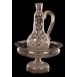 An early 20th Century circular engraved glass stand, engraved foliage with hollow stem and base,