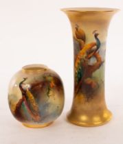 A Royal Worcester cylindrical trumpet vase painted peacocks among spruce branches on a gilt toned