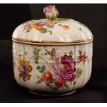 A German porcelain bowl and cover, ozier pattern moulded decoration, the cover with rose finial, 11.