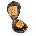 A Victorian gold locket inscribed Kildonan, the reverse with glazed panel containing a photograph,