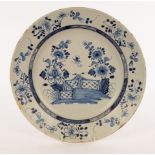 A Delft blue and white charger, possibly London, depicting a fenced garden,
