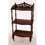 A Victorian rosewood three-tier whatnot with pierced gallery and turned supports,