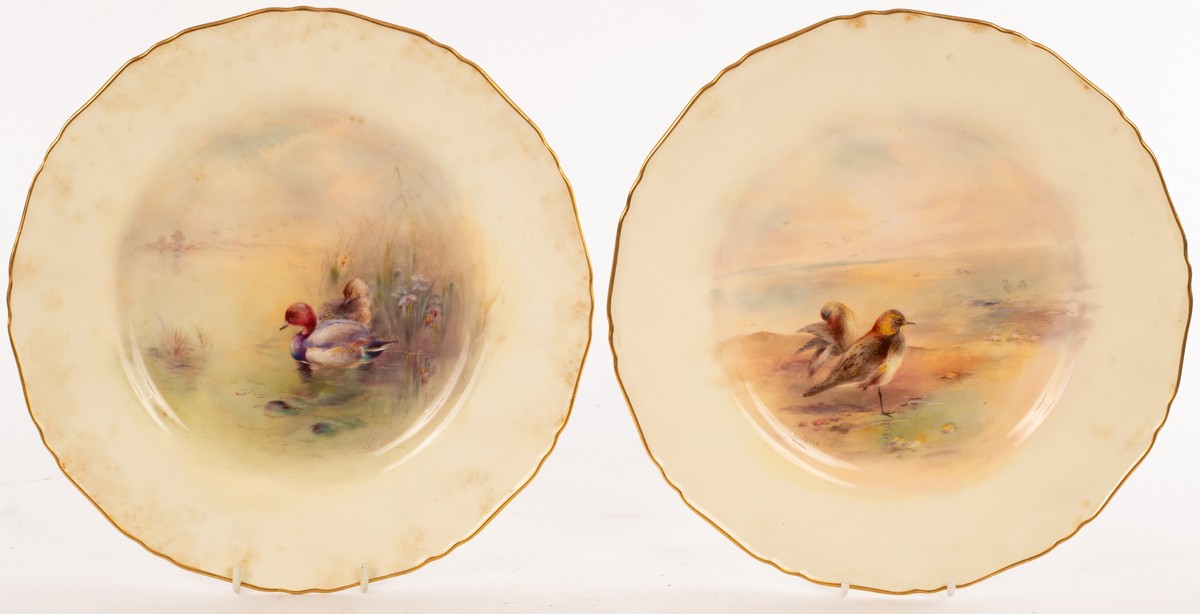 A pair of Royal Worcester plates painted a golden plover and pochard in wetlands by James Stinton,