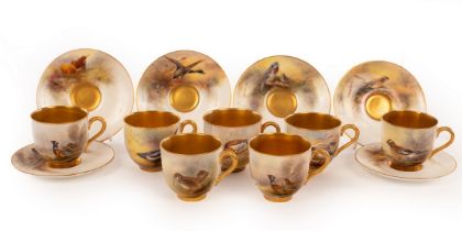 Royal Worcester, a composite set of seven coffee cups and saucers painted birds by James Stinton,
