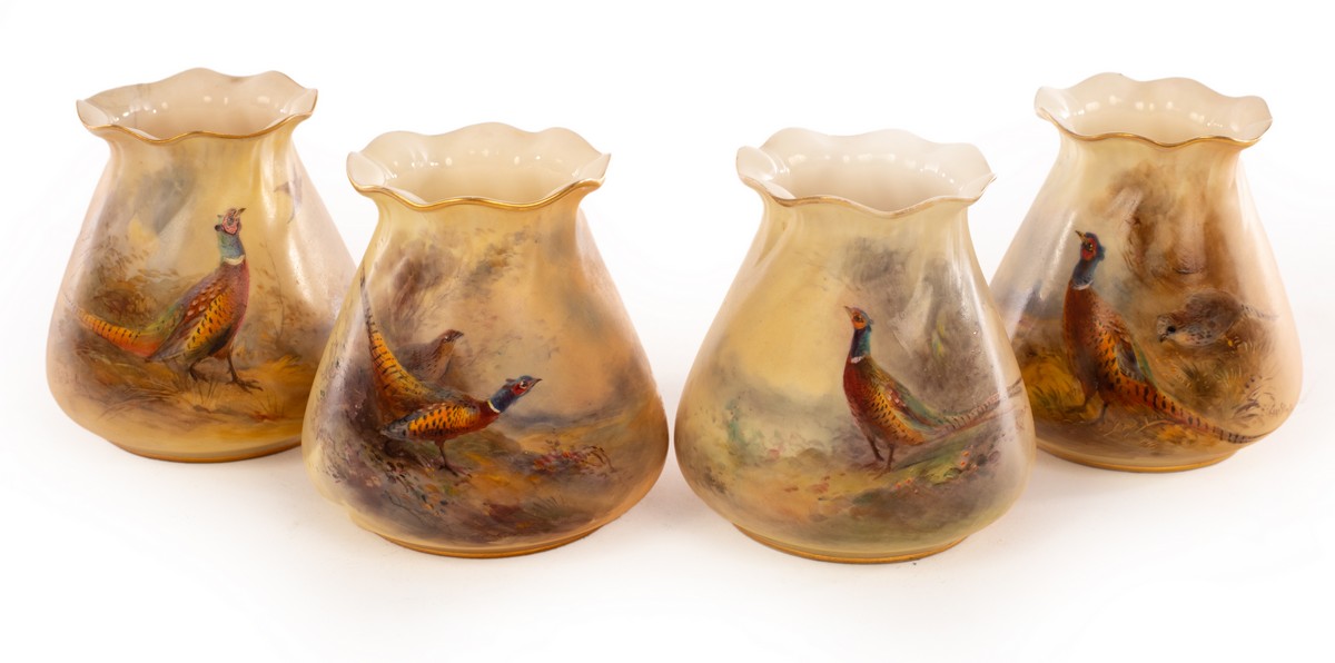 Four Royal Worcester small tapering vases with gilt edged flared necks,