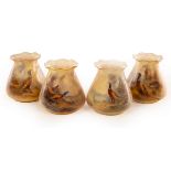 Four Royal Worcester small tapering vases with gilt edged flared necks,