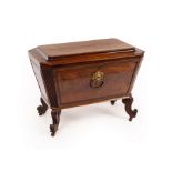 A Regency mahogany sarcophagus-shaped wine cooler with reeded, canted sides,