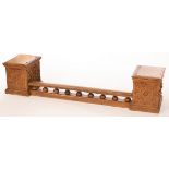 A Victorian oak fender, the galleried front rail flanked by a box with hinged lid to each side,