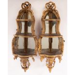 A pair of French gesso corner shelves,