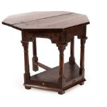 A mid 17th Century oak credence table, probably Somerset, on bold column supports,