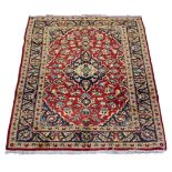 A Kashan rug,