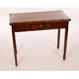 A George III mahogany card table, fitted a drawer on square moulded legs,