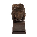 A 14th/15th Century carved stone head, probably French, modelled as a king wearing a crown,