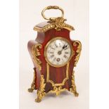 An early 20th Century faux tortoiseshell and gilt metal mounted mantel clock,