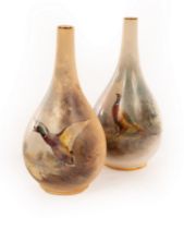 Two Royal Worcester pear-shaped vases with gilt rimmed narrow necks by James Stinton, signed,