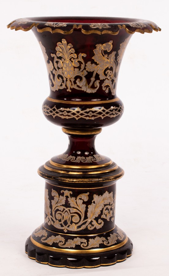 A 19th Century cranberry glass pedestal urn,