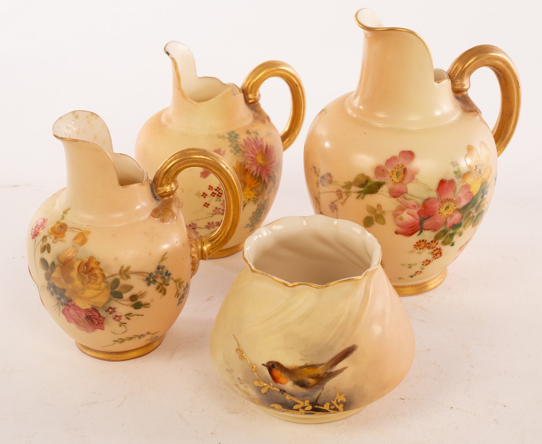 Two Royal Worcester blush ivory jugs painted polychrome flowers, 13.