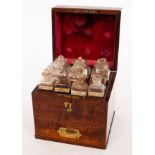 An apothecary's mahogany cabinet, 19th Century, fitted glass bottles and covers,